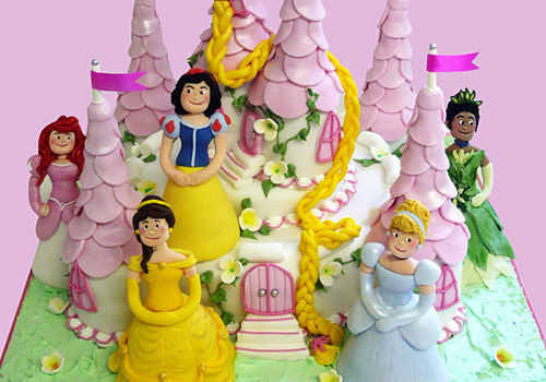 A fairy princess in her castle cake
